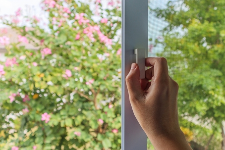 hand on a window sill